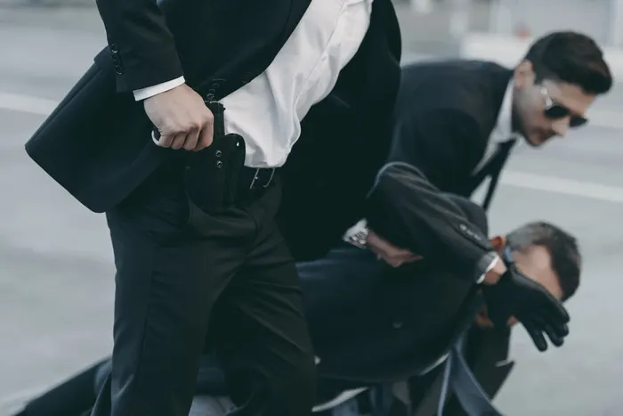 Executive protection agents escorting a client